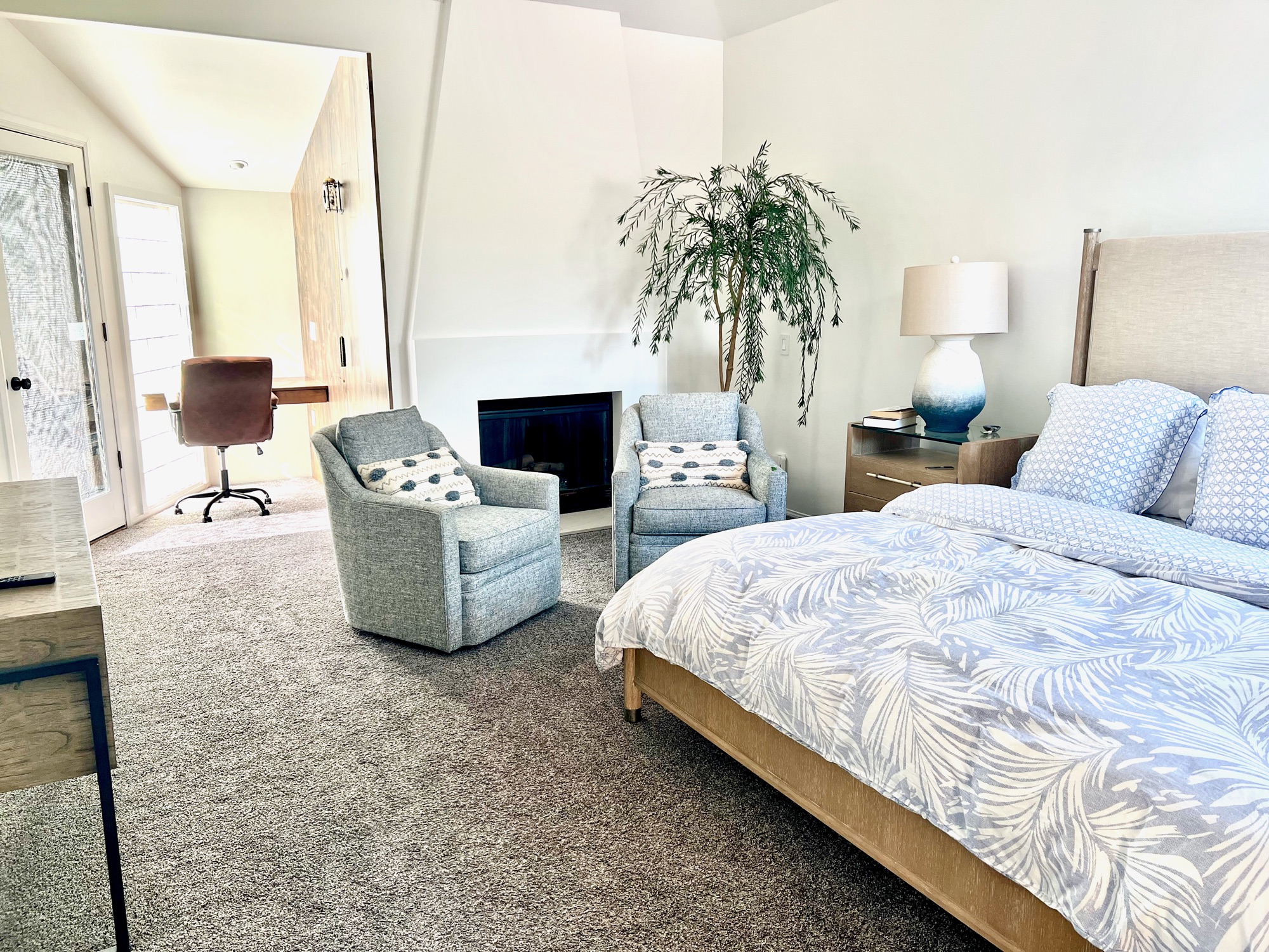 Second bedroom — king bed, garden views