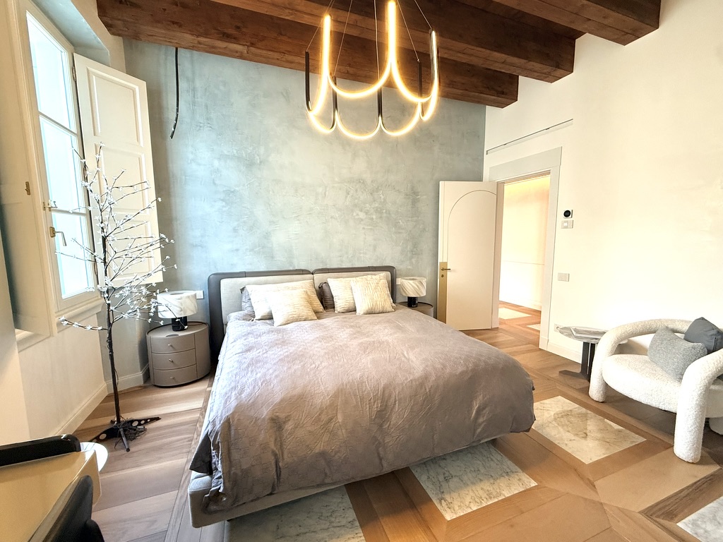 Second bedroom — Venetian plaster and sculpted light