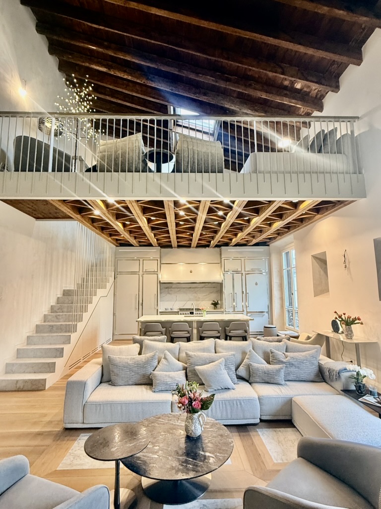 Living room beneath the loft and the beamed ceiling