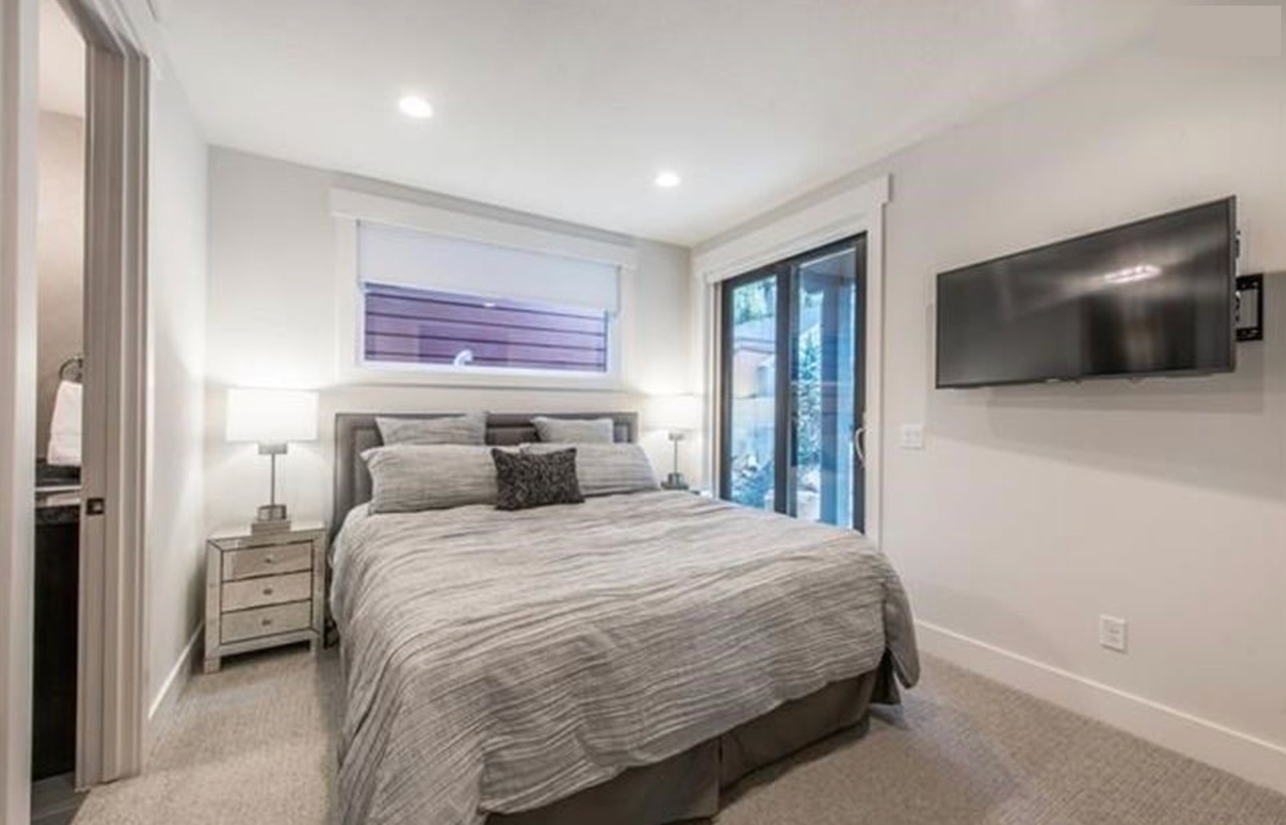 Guest bedroom — king bed, sliding door to back patio