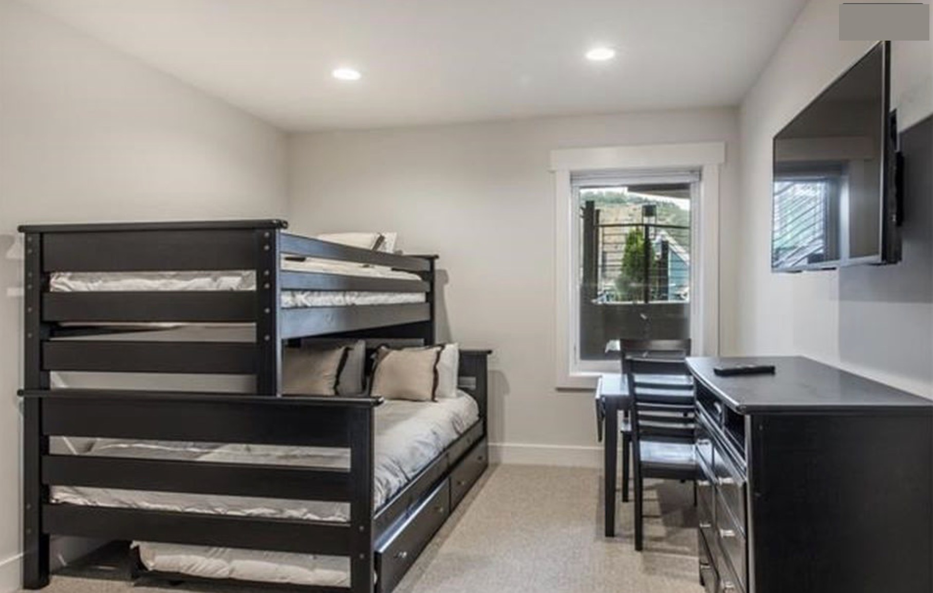 Bunk room — twin-over-full bunk plus trundle, sleeps four