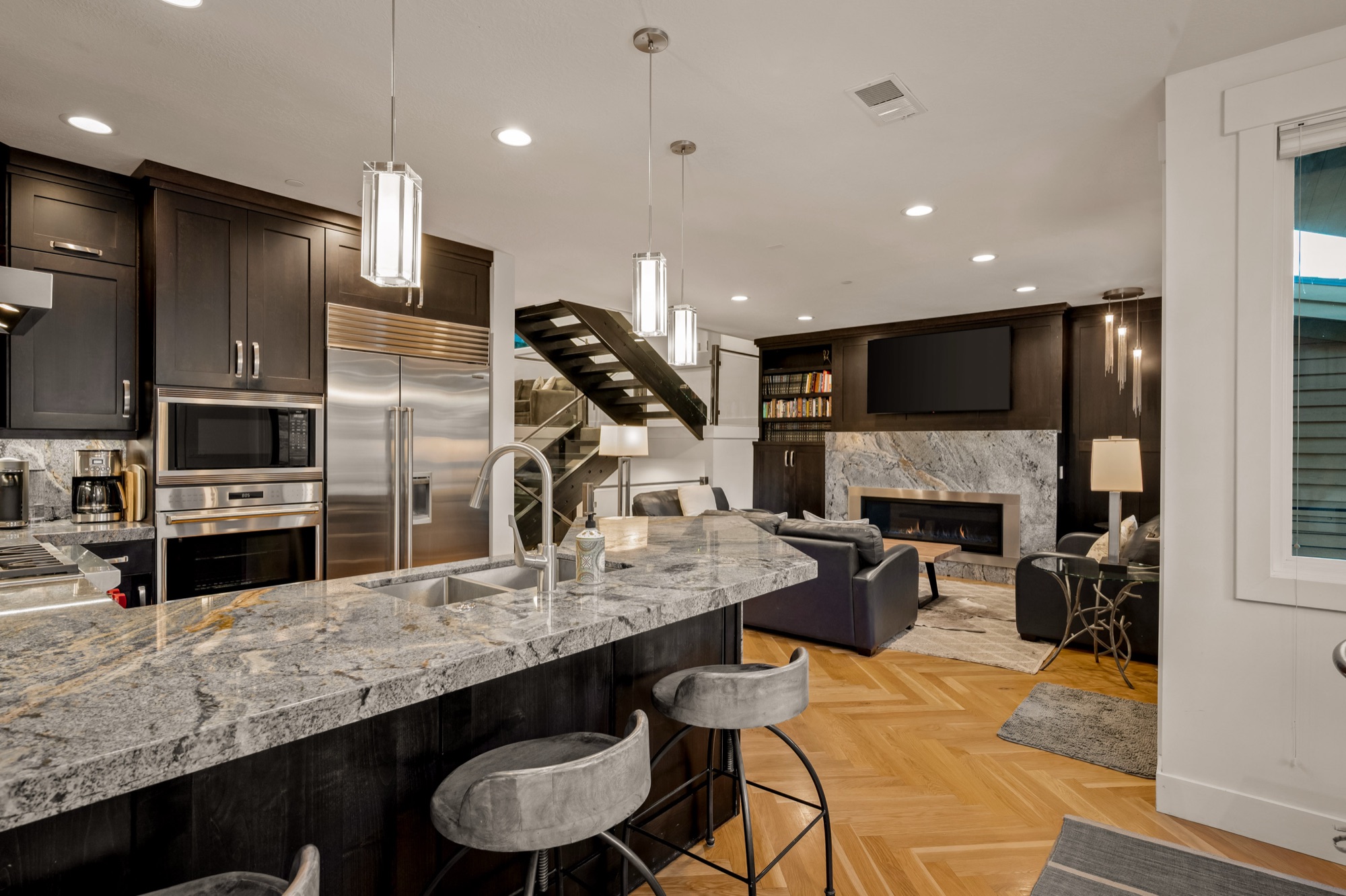 Chef's kitchen — granite island, Wolf range, herringbone walnut floor