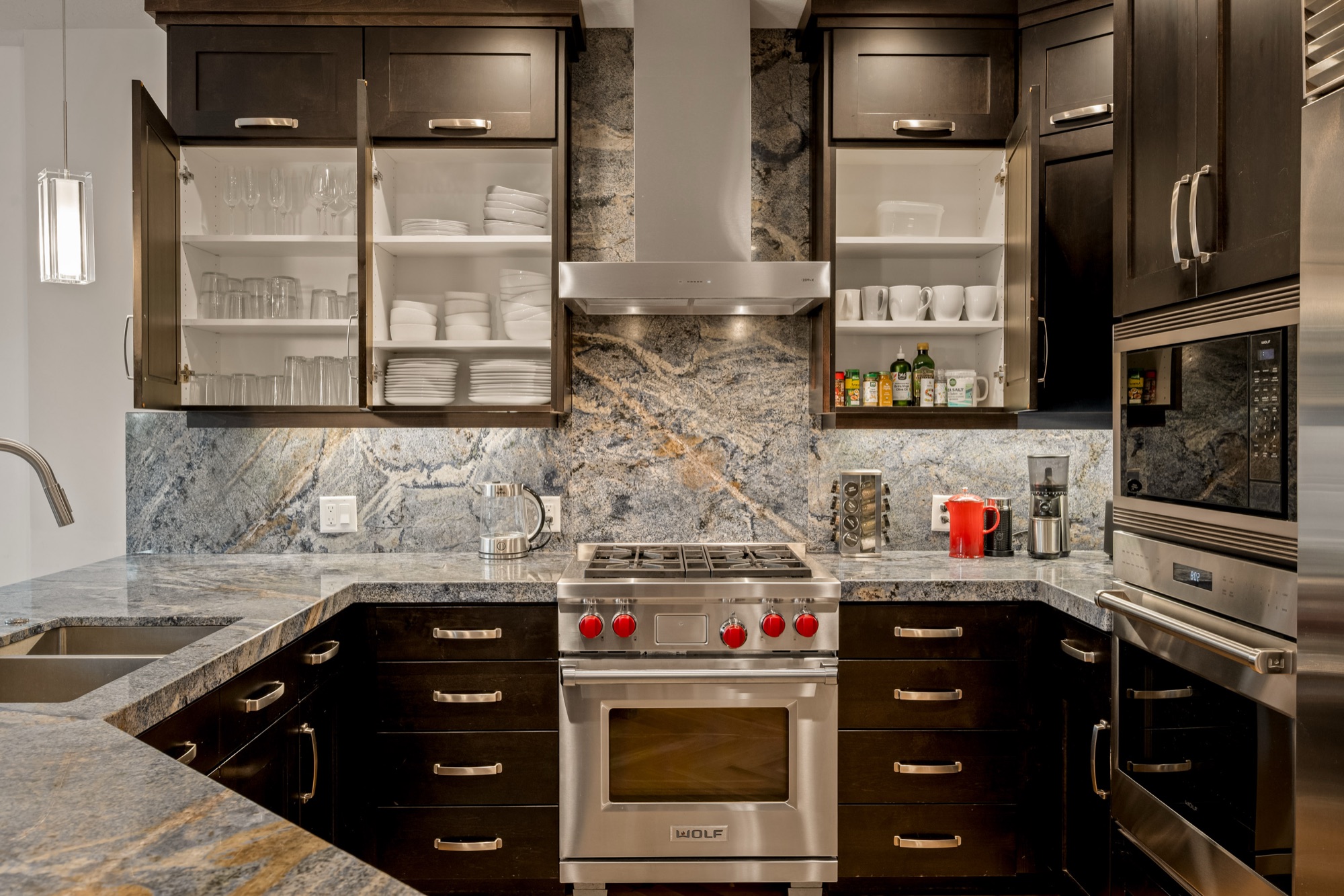 Kitchen with Wolf range and blue-veined stone