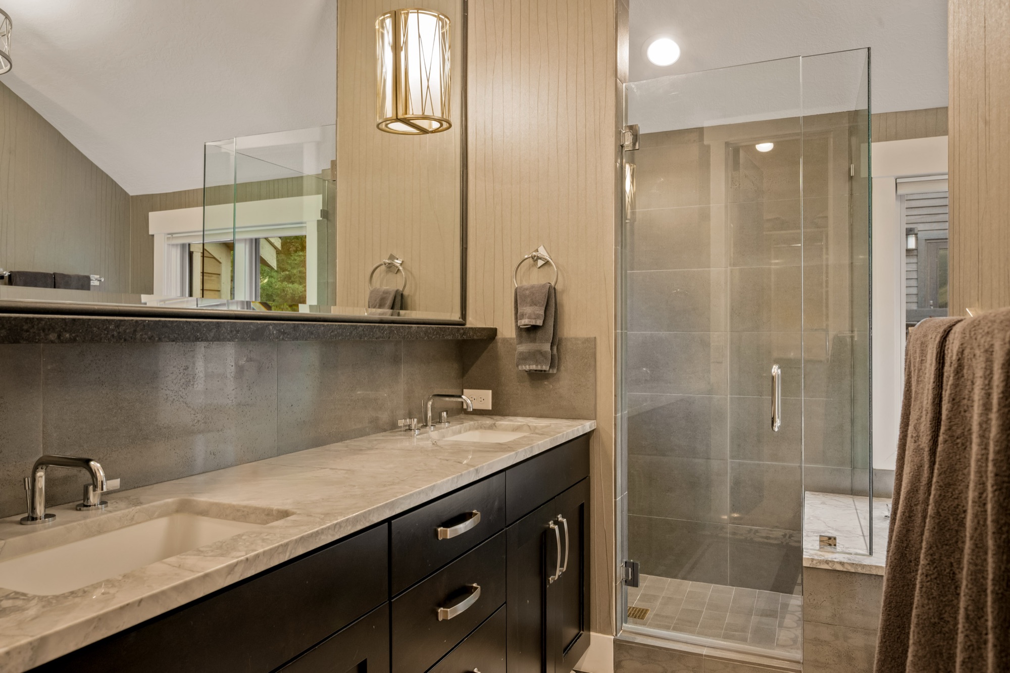 Master bathroom — patterned cement tile floor, double vanity, mountain view